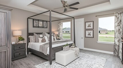 Modern bedroom in a new house with a view of the yard. Ideal for interior design or real estate purposes