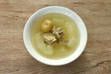 boiled winter melon pork bone with pickled lemon in clear soup on bowl