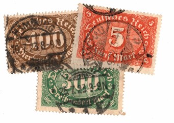 A montage of antique German postage stamps on a white background.