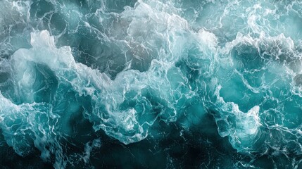 Mesmerizing aerial view of ocean waves crashing creating stunning teal patterns