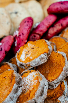 Sklandrausi &mdash; Latvian traditional dish from Kurzeme. Sweet potato and carrot cake with rye flour pie in fair. Farmers market stand.