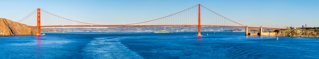 A panorama view at sunset towards the ocean side of the Golden Gate bridge in San Francisco in early springtime