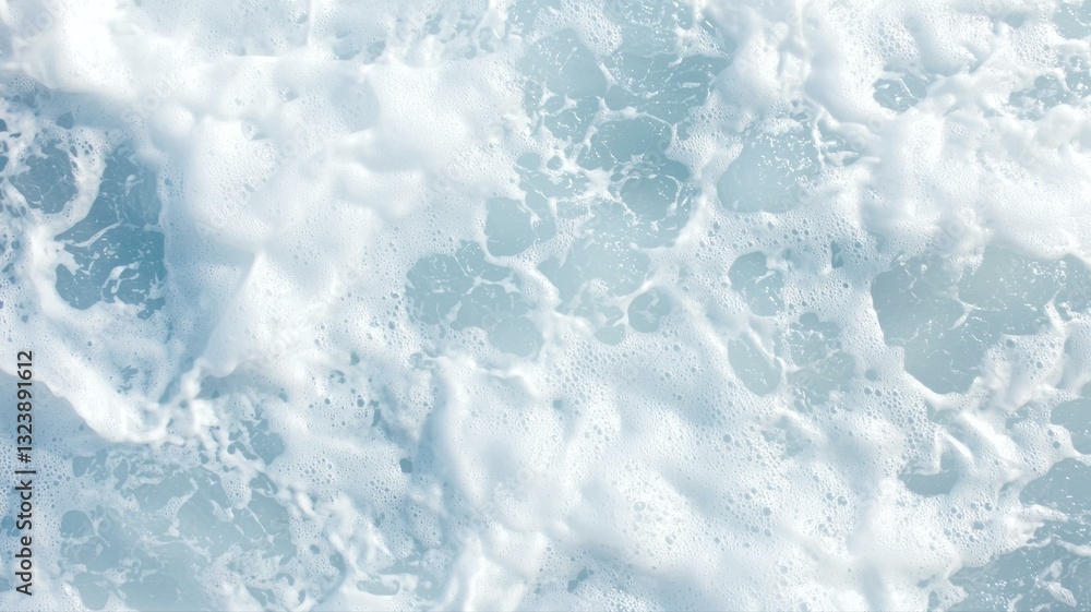 Poster foamy ocean waves crashing, creating a natural texture and dynamic movement in the water surface.