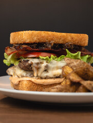 Frontal View of Square Burger with Gouda and Air-Fried Potatoes