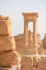 Obraz premium Ancient Architecture with Stone Columns and Historical Buildings in a Desert Landscape, Temple of Bel, Palmyra