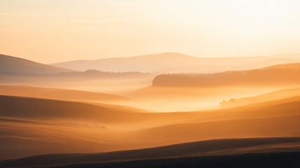 Obraz premium Serene Sunrise Over Rolling Hills and Misty Landscape at Dawn