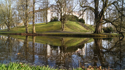On the hill surrounded by a moat stands a historic castle