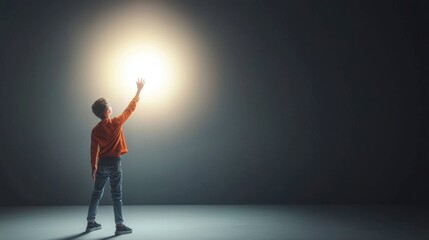 Person Reaching for Bright Light in Dark Room
