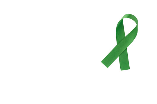 Green ribbon, symbol of social awareness, isolated background. World Cancer Day. copy space.