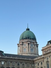 Green aged roof on a dome