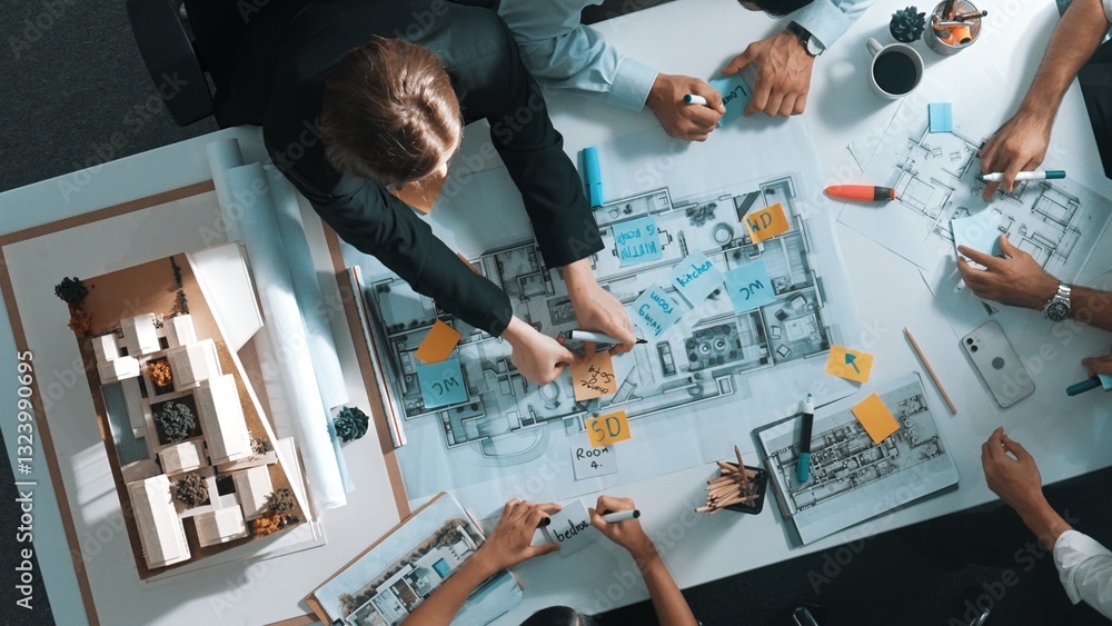 Poster top aerial view of project manager or civil engineer writing at blueprint and planning building desi