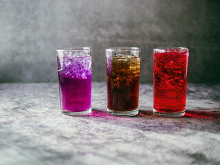 A lot of Soft drinks in colorful and flavorful glasses on the table,Glasses with sweet drinks with...