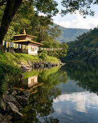 Fototapeta premium Serene lake with a Buddhist temple on the shore, colorful prayer flags fluttering in the breeze, surrounded by lush green mountains and clear blue sky, reflecting in the calm water