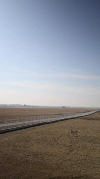 Vertical screen: An Airbus A321 takes off, leaving the runway behind. The airport landscape and clear sky emphasize the excitement of flight and travel, creating a dynamic aviation scene.
