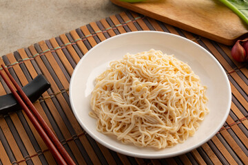 Shirataki with oat fiber,Oat noodles with konjac in white plate.low calorie,high fiber,no fat.food for weight loss.