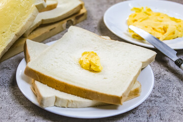 slices of bread with butter on the table as a breakfast menu