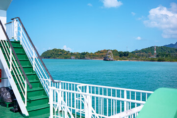 View of Tropical Island From Green Ferry Deck on a Sunny Day..