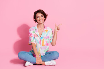 Full size photo of lovely young woman direct fingers empty space wear shirt isolated on pink color...