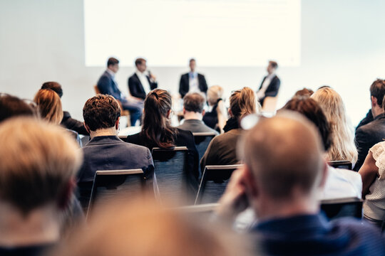 Interview and round table discussion at business convention and presentation. Audience at the conference hall. Business and entrepreneurship symposium.