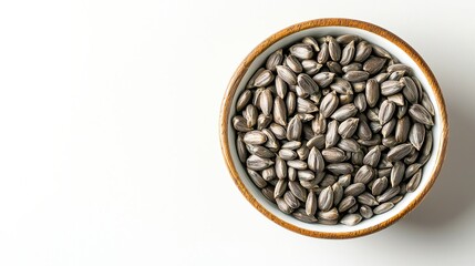 Fototapeta premium Fresh Sunflower Seed Oil in Wooden Bowl on Top with White Background View - Harvest Heap