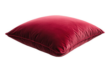Luxurious deep red velvet cushion resting elegantly on a minimalist white surface in soft lighting isolated on transparent background