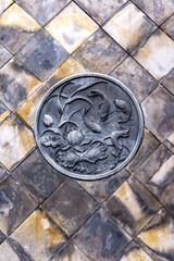 The walls are decorated with carved lotus flowers and fish