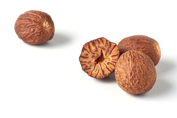 aromatic nutmegs isolated on white table