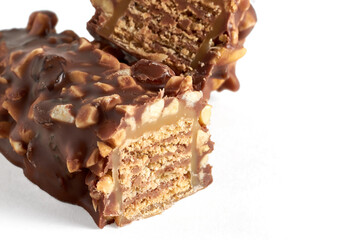 cross section of wafer caramel sweet bar covered with chocolate isolated on white table