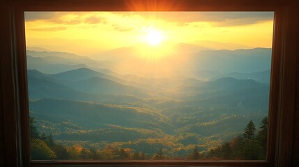 A scenic view of mountains and the setting sun seen through a window