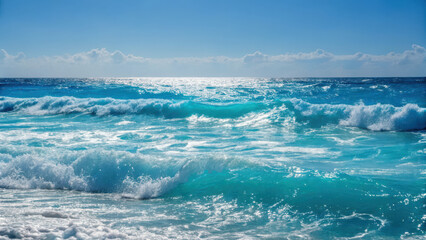 Vibrant ocean waves crashing against shore under clear blue sky