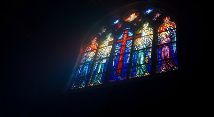 Stained glass windows in a cathedral. Religious, architectural design perfect for faith, church, or historical themes
