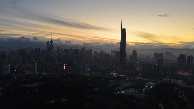 kuala lumpur morning scenery 2025 dramatic sunrise and busy street with cars