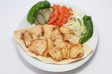 Tavuk Döner - Turkish Chicken Doner Kebap with garni on the wood