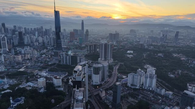 kuala lumpur morning scenery 2025 dramatic sunrise and busy street with cars