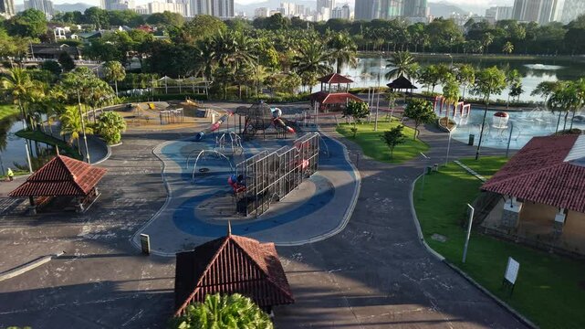 kuala lumpur park sunrise sun with blue lake and pedestrian jog