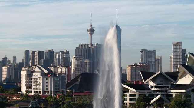 kuala lumpur park sunrise sun with blue lake and pedestrian jog
