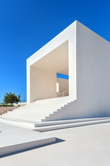 Minimalist white architecture under clear blue sky