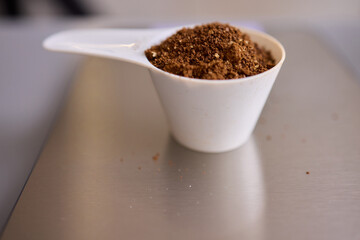 A gloved hand prepares to perform a care procedure safely and professionally in healthcare