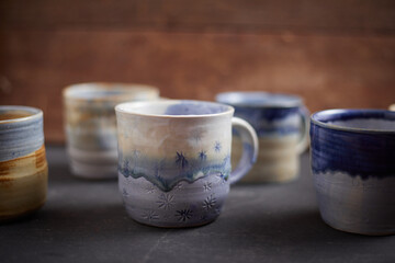 Ceramic cup on rustic background