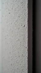 A close-up view of an acoustic panel with textured surface.