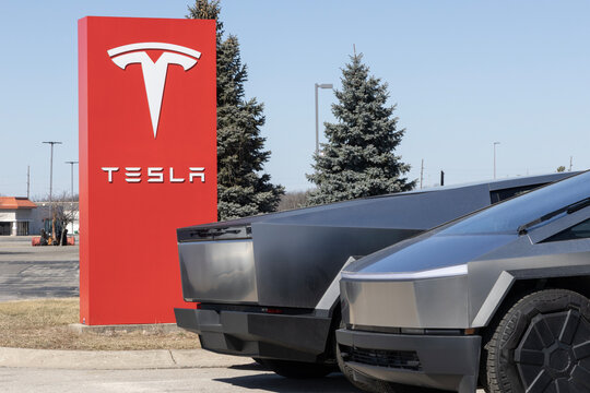 Tesla Cybertruck display at a dealership. Tesla offers the Cybertruck with up to 325 miles of driving range. MY:2024
