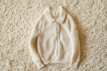 Cozy fashion apparel indoor setting clothing image soft textured environment overhead view comfort and style
