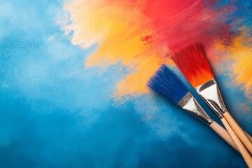 Fototapeta premium Brightly Colored Paint Brushes on Vibrant Abstract Blue and Orange Background