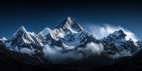 Majestic Snowy Mountain Peaks Rise Against a Clear Blue Sky With Clouds Swirling Around Them Generative AI
