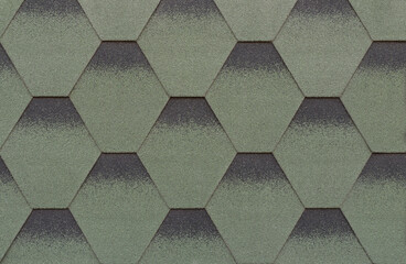 Texture of green hexagonal bitumen tiles background close up