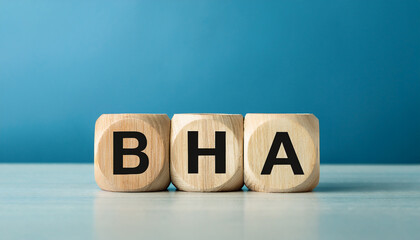 Wood cubes with abbreviation BHA. Beta Hydroxy Acid. Retinoids and dermatology concept.