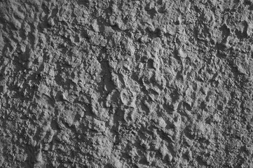 gray background, photo shows texture of plaster of concrete wall of building