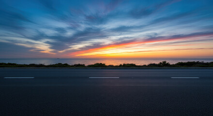 Obraz premium Coastal Road Sunset: Stunning Ocean Views & Open Road. Drive into Paradise!