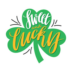 Obraz premium Sweet and lucky hand-lettered text on a green shamrock. Festive St. Patrick’s Day design with clover leaves and decorative elements on a white background.