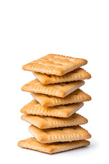 Stacked pile of crispy saltine crackers, isolated on white background